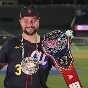 Jul 14, 2025; Atlanta, GA, USA; Seattle Mariners catcher Cal Raleigh (29) holds the trophy after winning the 2025 Home Run Derby at Truist Park. Mandatory Credit: Brett Davis-Imagn Images