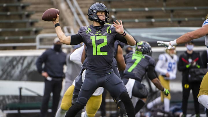 Nov 21, 2020; Eugene, Oregon, USA; Oregon Ducks quarterback Tyler Shough (12) throws a pass during the second half against the UCLA Bruins at Autzen Stadium.
