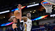 Oct 7, 2024; New Orleans, Louisiana, USA; New Orleans Pelicans center Yves Missi (21) fouls Orlando Magic center Moritz Wagner (21) during the first half at Smoothie King Center.