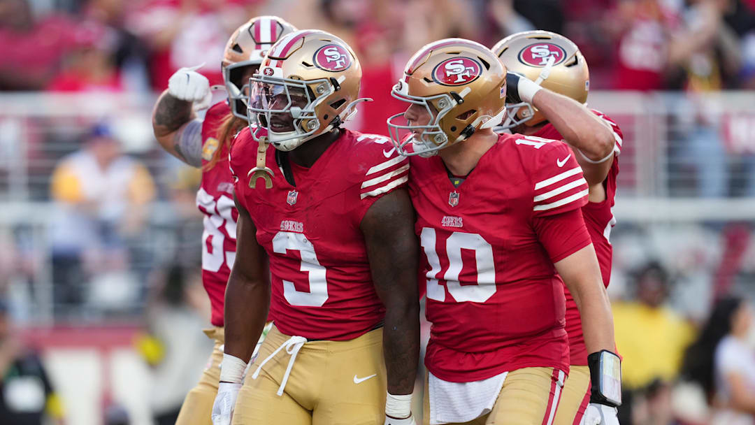 Nov 9, 2025; Santa Clara, California, USA; San Francisco 49ers running back Brian Robinson Jr. (3) and San Francisco 49ers quarterback Mac Jones (10) celebrate after a touchdown during the third quarter against the Los Angeles Rams at Levi's Stadium. Mandatory Credit: Cary Edmondson-Imagn Images