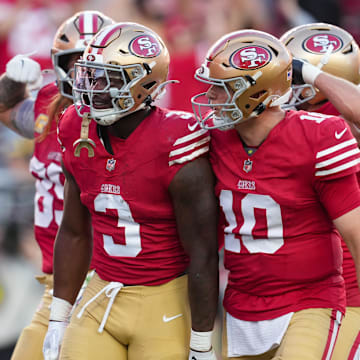 Nov 9, 2025; Santa Clara, California, USA; San Francisco 49ers running back Brian Robinson Jr. (3) and San Francisco 49ers quarterback Mac Jones (10) celebrate after a touchdown during the third quarter against the Los Angeles Rams at Levi's Stadium. Mandatory Credit: Cary Edmondson-Imagn Images