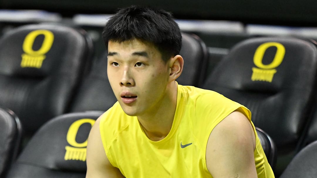 Feb 25, 2026; Eugene, Oregon, USA; Oregon Ducks guard Wei Lin (23) prepares to warm up on the court before the game against the Wisconsin Badgers at Matthew Knight Arena. Mandatory Credit: Craig Strobeck-Imagn Images