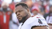 Tampa Bay Buccaneers defensive end Ndamukong Suh walks onto the field.