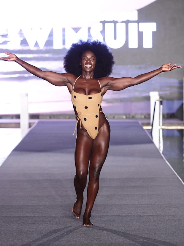Tunde Oyeneyin walks the runway for the Sports Illustrated Swimsuit Runway Show