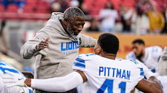 Detroit Lions defensive coordinator Aaron Glenn hugs linebacker Anthony Pittman during warmups before the game against the San Francisco 49ers at Levi's Stadium in Santa Clara, Calif. on Monday, Dec. 30, 2024.