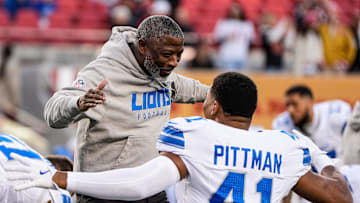 Detroit Lions defensive coordinator Aaron Glenn hugs linebacker Anthony Pittman during warmups before the game against the San Francisco 49ers at Levi's Stadium in Santa Clara, Calif. on Monday, Dec. 30, 2024.