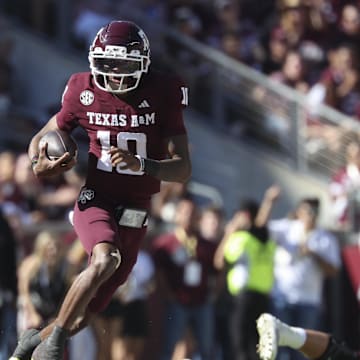Nov 15, 2025; College Station, Texas, USA; Texas A&M Aggies quarterback Marcel Reed (10) runs with the ball during the third quarter against the South Carolina Gamecocks at Kyle Field. Mandatory Credit: Troy Taormina-Imagn Images