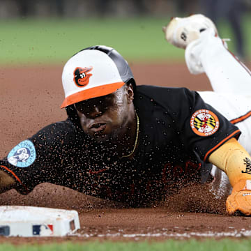 Jul 28, 2025; Baltimore, Maryland, USA; Baltimore Orioles outfielder Cedric Mullins (31) slides into third base safely during the sixth inning against the Toronto Blue Jays at Oriole Park at Camden Yards. Mandatory Credit: Daniel Kucin Jr.-Imagn Images
