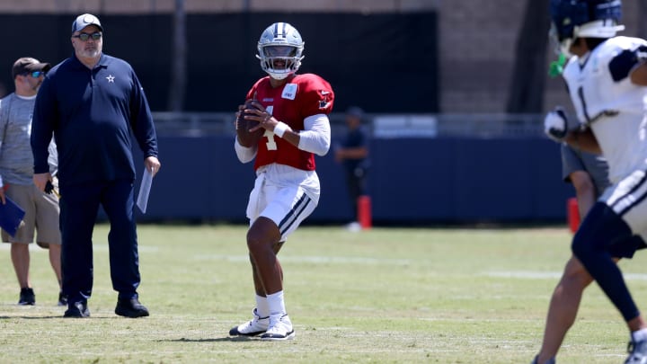 Dallas Cowboys head coach Mike McCarthy watches quarterback Dak Prescott (4) during training camp at the River Ridge Playing Fields in Oxnard, California.