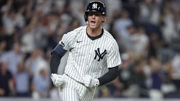 Jul 30, 2025; Bronx, New York, USA;  New York Yankees third baseman Ryan McMahon (19) hits a game winning RBI single in the eleventh inning to defeat the Tampa Bay Rays 5-4 at Yankee Stadium. Mandatory Credit: Wendell Cruz-Imagn Images