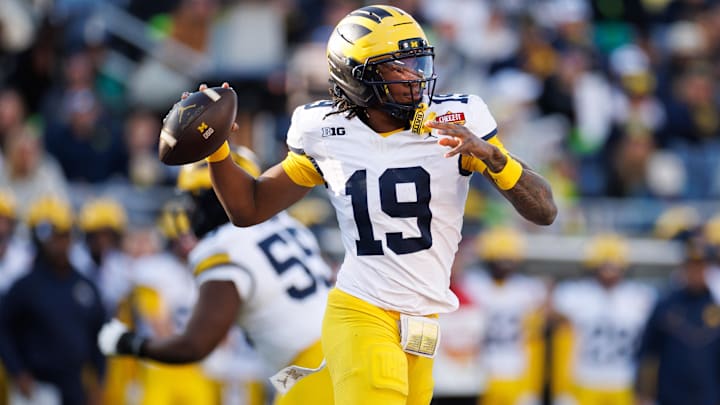 Dec 31, 2025; Orlando, FL, USA; Michigan Wolverines quarterback Bryce Underwood (19) throws the ball against the Texas Longhorns during the second half at Camping World Stadium. Mandatory Credit: Matt Pendleton-Imagn Images