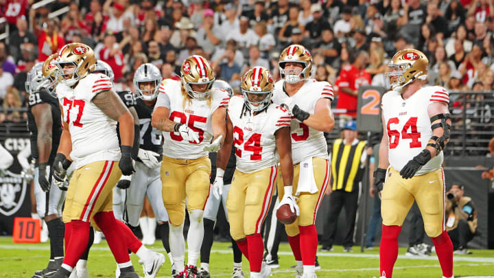 Aug 23, 2024; Paradise, Nevada, USA; San Francisco 49ers running back Jordan Mason (24) celebrates with team mates after scoring a touchdown against the Las Vegas Raiders during the first quarter at Allegiant Stadium. Mandatory Credit: Stephen R. Sylvanie-USA TODAY Sports