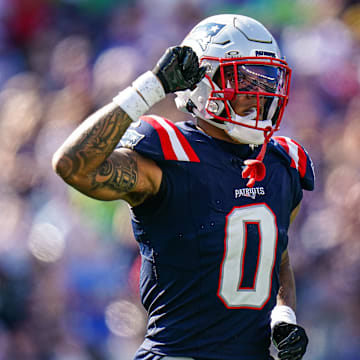 Sep 15, 2024; Foxborough, Massachusetts, USA; New England Patriots cornerback Christian Gonzalez (0) reacts after a play against the Seattle Seahawks in the second half at Gillette Stadium. Mandatory Credit: David Butler II-Imagn Images