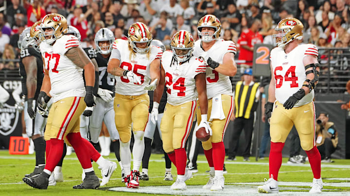 Aug 23, 2024; Paradise, Nevada, USA; San Francisco 49ers running back Jordan Mason (24) celebrates with team mates after scoring a touchdown against the Las Vegas Raiders during the first quarter at Allegiant Stadium. Mandatory Credit: Stephen R. Sylvanie-Imagn Images