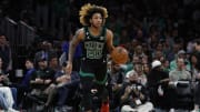 Apr 7, 2023; Boston, Massachusetts, USA; Boston Celtics guard JD Davison (20) brings the ball up the court against the Toronto Raptors during the second half at TD Garden. Mandatory Credit: Winslow Townson-USA TODAY Sports