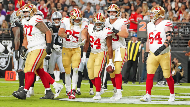 Aug 23, 2024; Paradise, Nevada, USA; San Francisco 49ers running back Jordan Mason (24) celebrates with team mates after scoring a touchdown against the Las Vegas Raiders during the first quarter at Allegiant Stadium. Mandatory Credit: Stephen R. Sylvanie-USA TODAY Sports