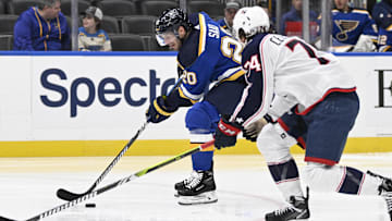 Sep 26, 2023; St. Louis, Missouri, USA; St. Louis Blues left wing Brandon Saad (20) controls the puck from Columbus Blue Jackets defenseman Corson Ceulemans (74) during the second period at Enterprise Center. Mandatory Credit: Jeff Le-Imagn Images