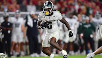 Sep 20, 2025; Los Angeles, California, USA; Michigan State Spartans running back Makhi Frazier (5) runs the ball against the Southern California Trojans during the second half at the Los Angeles Memorial Coliseum. Mandatory Credit: Gary A. Vasquez-Imagn Images