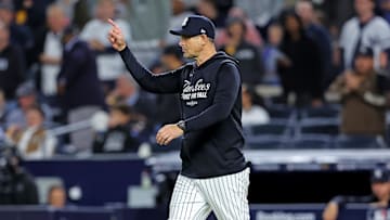 Oct 8, 2025; Bronx, New York, USA; New York Yankees manager Aaron Boone signals to the bullpen during the seventh inning against the Toronto Blue Jays during game four of the ALDS round for the 2025 MLB playoffs at Yankee Stadium. Mandatory Credit: Brad Penner-Imagn Images