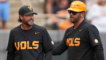 Tennessee assistant coach Ross Kivett leads Tennessee baseball head coach Tony Vitello back to the dugout after speaking with the umpire during a NCAA baseball game between the Tennessee Volunteers and Vanderbilt Commodores at Lindsey Nelson Stadium on May 11, 2025.