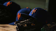 Apr 8, 2022; Washington, District of Columbia, USA;  A detail view of New York Mets hats and gloves during the game between the Washington Nationals and the New York Mets at Nationals Park. Mandatory Credit: Tommy Gilligan-Imagn Images