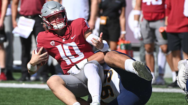 Sep 16, 2023; Pullman, Washington, USA; Washington State Cougars quarterback John Mateer (10) is tackled for a loss by Northern Colorado Bears defensive lineman Michael Jordan (99) in the first half at Gesa Field at Martin Stadium. Mandatory Credit: James Snook-USA TODAY Sports