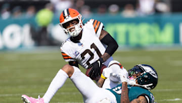 Oct 13, 2024; Philadelphia, Pennsylvania, USA; Cleveland Browns cornerback Denzel Ward (21) breaks up a pass to Philadelphia Eagles wide receiver DeVonta Smith (6) during the first quarter at Lincoln Financial Field. Mandatory Credit: Bill Streicher-Imagn Images