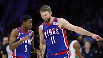 Jan 29, 2025; Philadelphia, Pennsylvania, USA; Sacramento Kings guard De'Aaron Fox (5) and forward Domantas Sabonis (11) talk during the second quarter against the Philadelphia 76ers at Wells Fargo Center. Mandatory Credit: Bill Streicher-Imagn Images