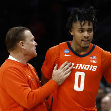 Mar 30, 2024; Boston, MA, USA; Illinois Fighting Illini head coach Brad Underwood reacts with guard Terrence Shannon Jr. (0) against the Connecticut Huskies in the finals of the East Regional of the 2024 NCAA Tournament at TD Garden. Mandatory Credit: Winslow Townson-USA TODAY Sports