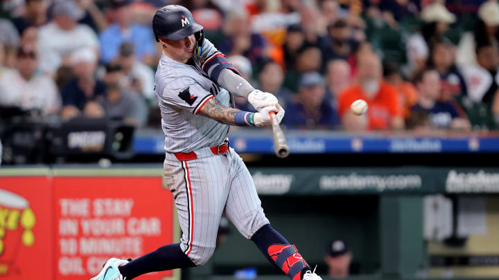 Jun 1, 2024; Houston, Texas, USA; Minnesota Twins third baseman Jose Miranda (64) hits an RBI single against the Houston Astros during the seventh inning at Minute Maid Park. Mandatory Credit: Erik Williams-USA TODAY Sports