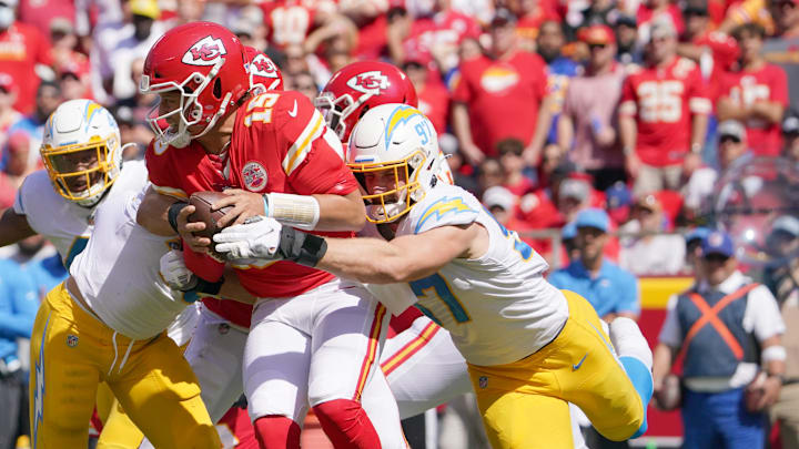 Sep 26, 2021; Kansas City, Missouri, USA; Kansas City Chiefs quarterback Patrick Mahomes (15) is sacked by Los Angeles Chargers defensive end Joey Bosa (97) 