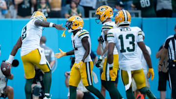 Green Bay Packers quarterback Malik Willis (2) is congratulated for his rushing touchdown against the Tennessee Titans during their game at Nissan Stadium in Nashville, Tenn., on Sunday.