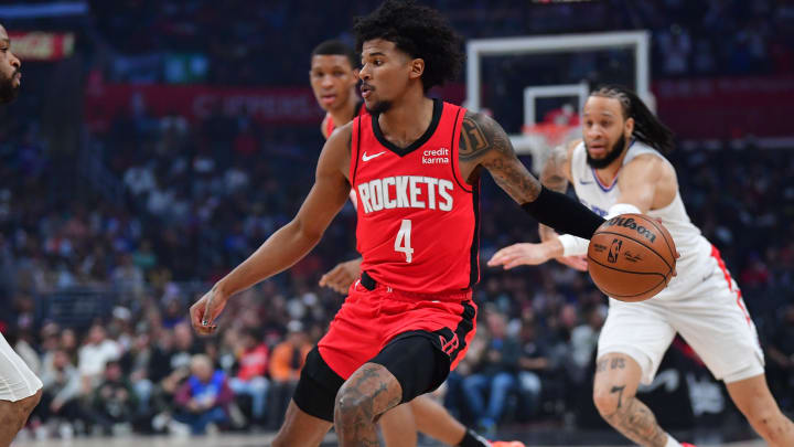 Apr 14, 2024; Los Angeles, California, USA; Houston Rockets guard Jalen Green (4) moves the ball against the Los Angeles Clippers during the first half at Crypto.com Arena. Mandatory Credit: Gary A. Vasquez-USA TODAY Sports