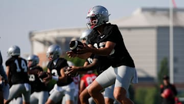 Ohio State Buckeyes quarterback Julian Sayin (10) takes a snap during football training camp at the Woody Hayes Athletic Center on Aug. 1, 2025.