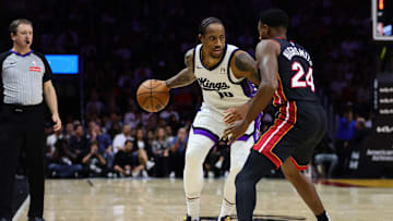 Nov 4, 2024; Miami, Florida, USA; Sacramento Kings forward DeMar DeRozan (10) dribbles the basketball as Miami Heat forward Haywood Highsmith (24) defends during the third quarter at Kaseya Center. Mandatory Credit: Sam Navarro-Imagn Images