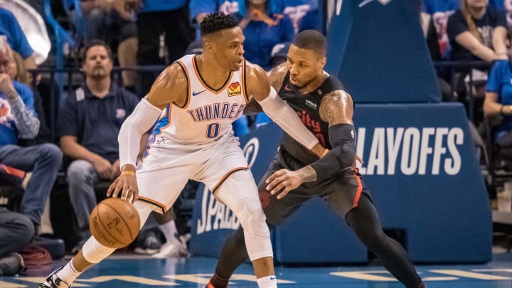 Apr 21, 2019; Oklahoma City, OK, USA; Oklahoma City Thunder guard Russell Westbrook (0) fights for position while defended by Portland Trail Blazers guard Damian Lillard (0) during the first half in game four of the first round of the 2019 NBA Playoffs at Chesapeake Energy Arena. Mandatory Credit: Rob Ferguson-USA TODAY Sports