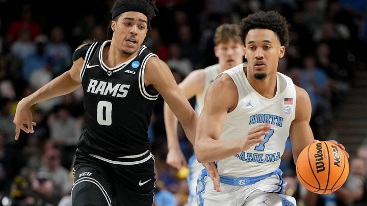 Mar 19, 2026; Greenville, SC, USA; North Carolina Tar Heels guard Seth Trimble (7) dribbles against VCU Rams guard Brandon Jennings (0) in the second half of a first round game of the men's 2026 NCAA Tournament at Bon Secours Wellness Arena. Mandatory Credit: Bob Donnan-Imagn Images