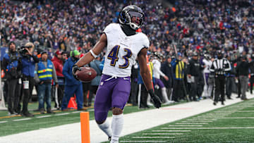 Dec 15, 2024; East Rutherford, New Jersey, USA; Baltimore Ravens running back Justice Hill (43) scores a touchdown reception during the second half against the New York Giants at MetLife Stadium. Mandatory Credit: Vincent Carchietta-Imagn Images