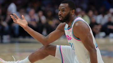 Mar 25, 2025; Miami, Florida, USA; Miami Heat forward Andrew Wiggins (22) reacts after shooting the basketball against the Golden State Warriors during the third quarter at Kaseya Center. Mandatory Credit: Sam Navarro-Imagn Images