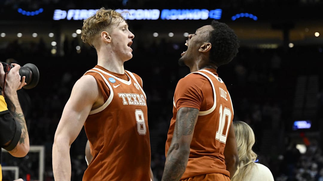 Mar 21, 2026; Portland, OR, USA; Texas Longhorns center Matas Vokietaitis (8) and forward Nic Codie (10) react after defeating the Gonzaga Bulldogs during a second round game of the men's 2026 NCAA Tournament at Moda Center. Mandatory Credit: Troy Wayrynen-Imagn Images