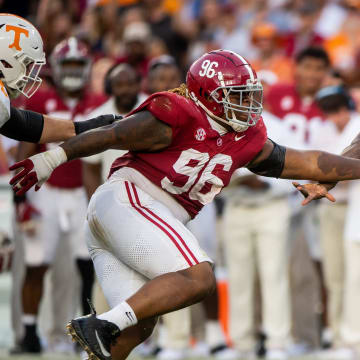 Alabama defensive lineman Tim Keenan III (96) chases after Tennessee quarterback Joe Milton III (7) during a football game between Tennessee and Alabama at Bryant-Denny Stadium in Tuscaloosa, Ala., on Saturday, Oct. 21, 2023.