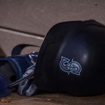 A view of a Seattle Mariners batting helmet and logo during the game between the Texas Rangers and the Seattle Mariners at Globe Life Field in 2022.