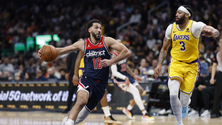 Apr 3, 2024; Washington, District of Columbia, USA; Washington Wizards forward Anthony Gill (16) drives to the basket as Los Angeles Lakers forward Anthony Davis (3) in the second half at Capital One Arena. Mandatory Credit: Geoff Burke-USA TODAY Sports