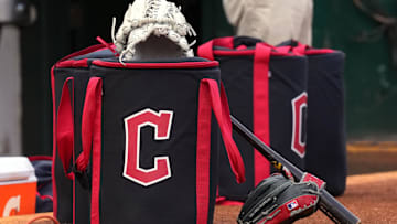 Mar 30, 2024; Oakland, California, USA; Cleveland Guardians equipment sits in front of the dugout before the game against the Oakland Athletics at Oakland-Alameda County Coliseum. Mandatory Credit: Darren Yamashita-Imagn Images