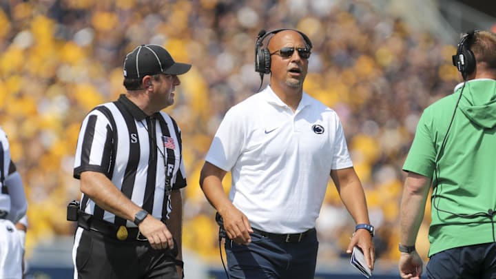 Penn State coach James Franklin talks to a referee during the first quarter against the West Virginia Mountaineers at Mountaineer Field at Milan Puskar Stadium. 