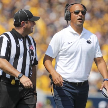 Penn State coach James Franklin talks to a referee during the first quarter against the West Virginia Mountaineers at Mountaineer Field at Milan Puskar Stadium.