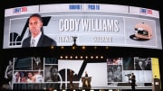 Jun 26, 2024; Brooklyn, NY, USA; Cody Williams walks on stage to meet NBA commissioner Adam Silver after being selected in the first round by the Utah Jazz in the 2024 NBA Draft at Barclays Center. Mandatory Credit: Brad Penner-USA TODAY Sports