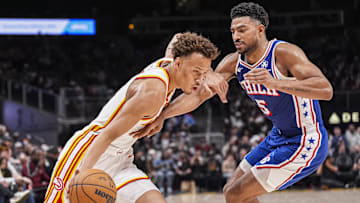 Mar 10, 2025; Atlanta, Georgia, USA; Atlanta Hawks guard Dyson Daniels (5) dribbles against Philadelphia 76ers guard Quentin Grimes (5) during the second half at State Farm Arena. Mandatory Credit: Dale Zanine-Imagn Images
