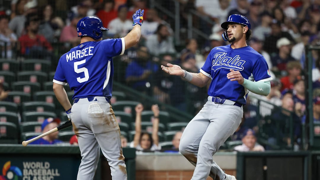 Mar 10, 2026; Houston, TX, United States;  Italy center fielder Jakob Marsee (5) celebrates right fielder Jac Caglianone (14) run against the United States in the sixth inning at Daikin Park. Mandatory Credit: Thomas Shea-Imagn Images