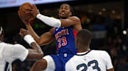 Oct 6, 2025; Memphis, Tennessee, USA; Detroit Pistons guard Jaden Ivey (23) drives to the basket as Memphis Grizzlies forward Cedric Coward (23) defends during the second quarter at FedExForum. Mandatory Credit: Petre Thomas-Imagn Images